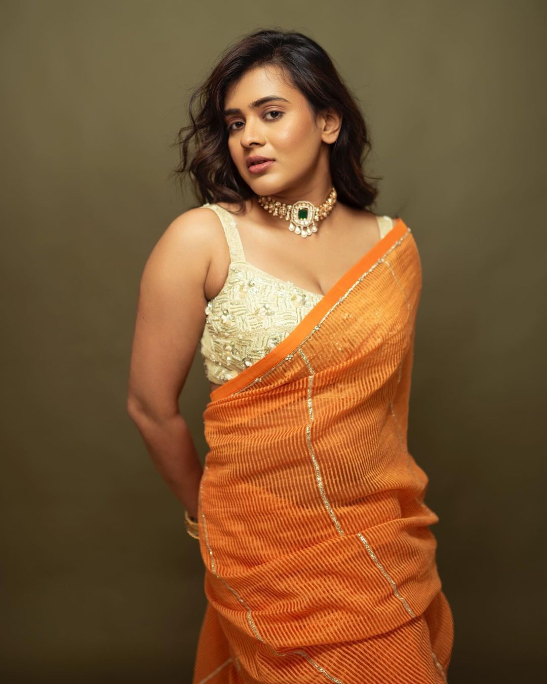 Indian Actress Hebah Patel Stills in Orange Saree